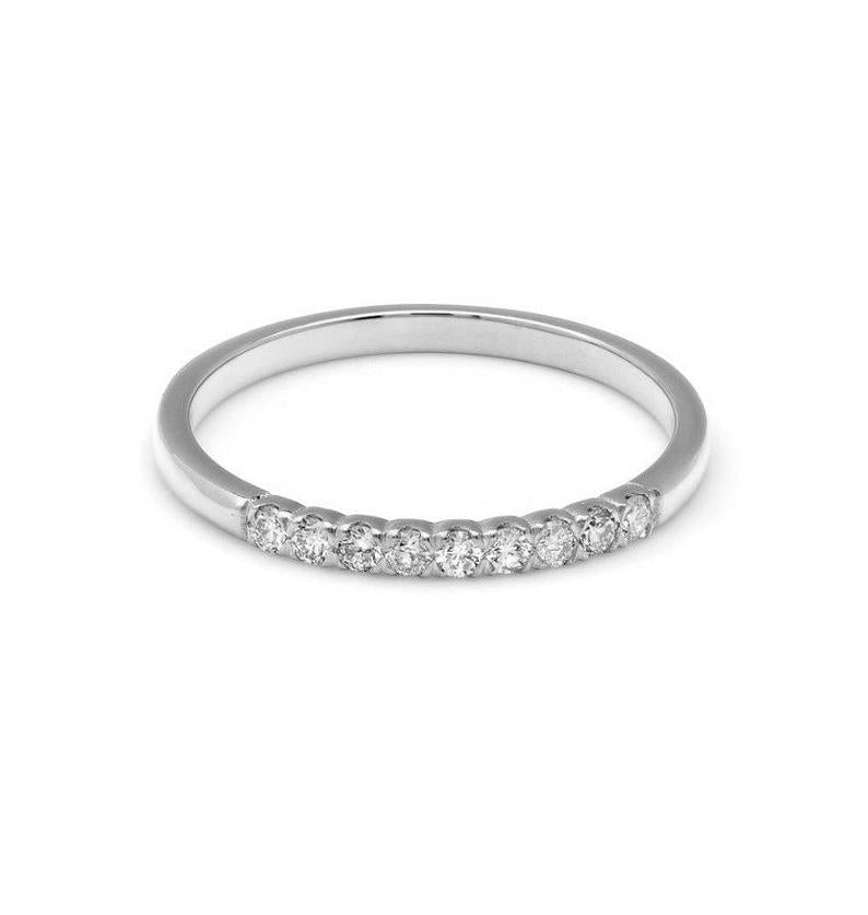 14K yellow gold diamond wedding band featuring 9 round diamonds, a shiny finish, and a delicate design, ideal for engagement.