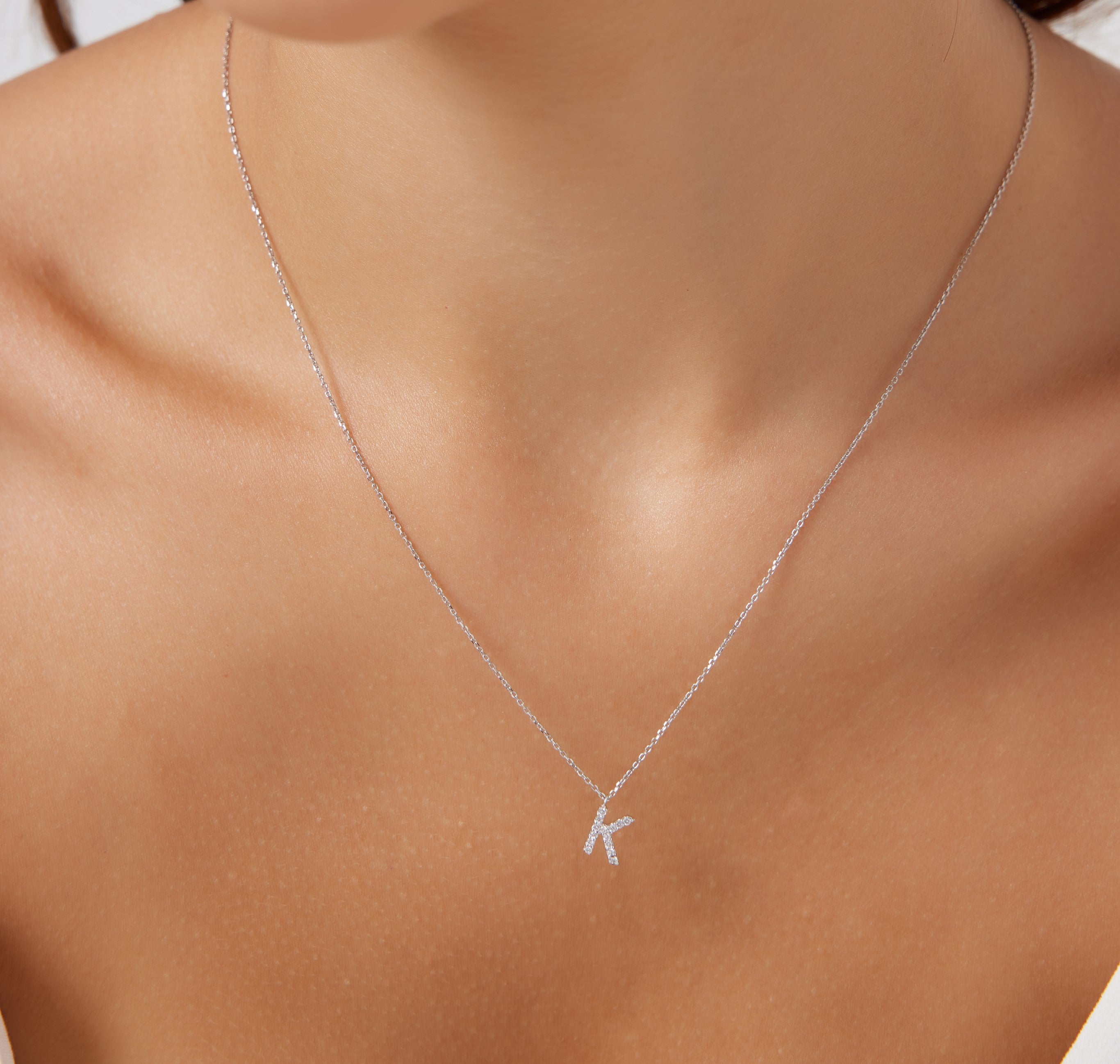 Dainty 14K white gold initial necklace with sparkling diamond letter K, ideal personalized jewelry gift.