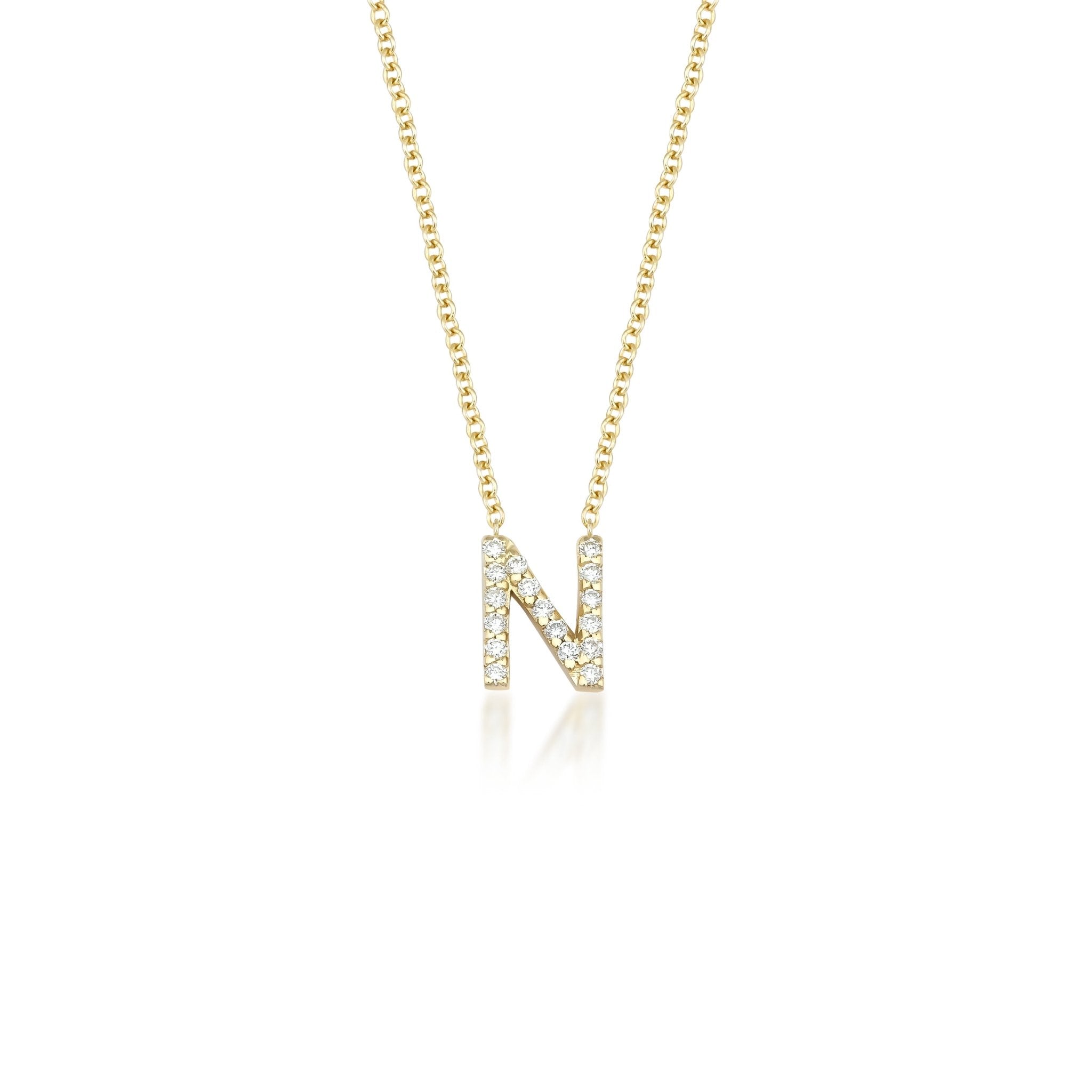 14K yellow gold initial necklace featuring diamond-studded letter N on a delicate chain, sparkling with white diamonds.