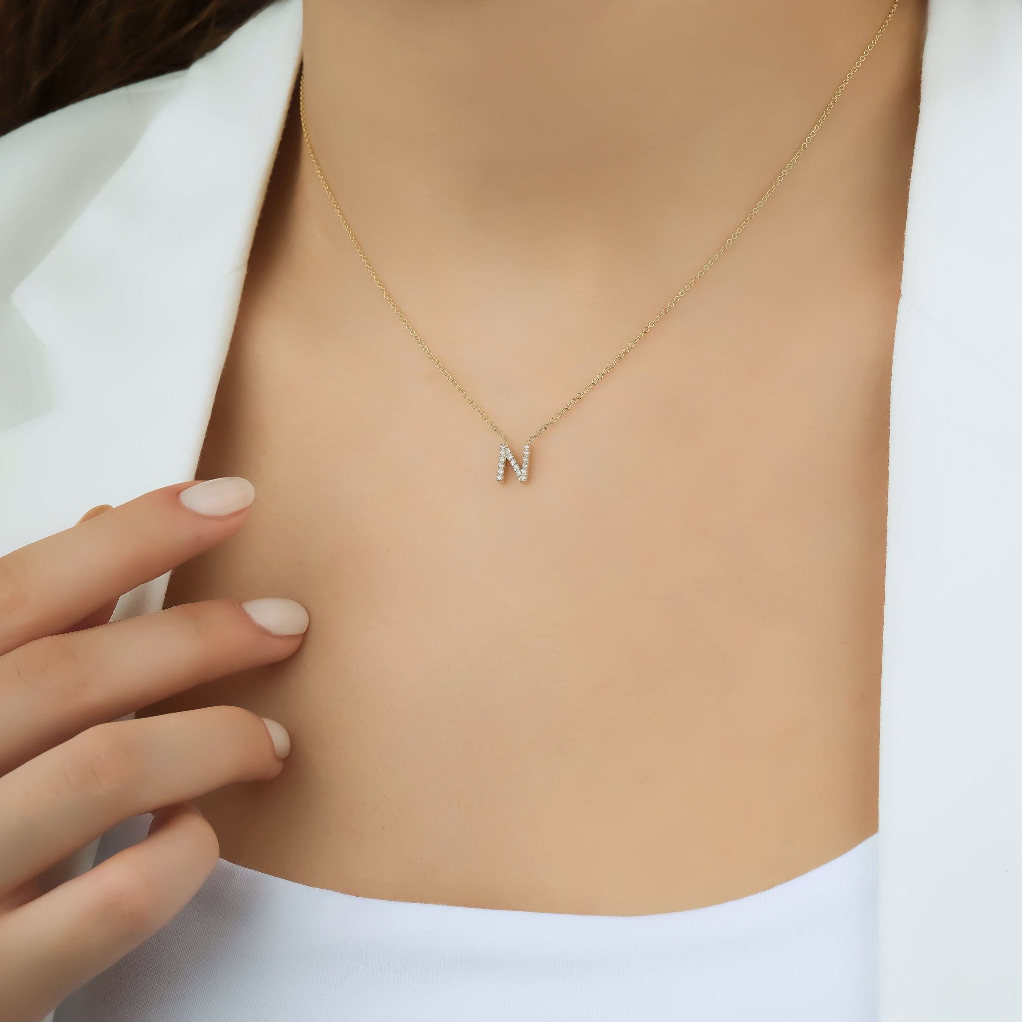 14K yellow gold initial necklace with diamond letter N, dainty design, perfect gift for personalized jewelry lovers.