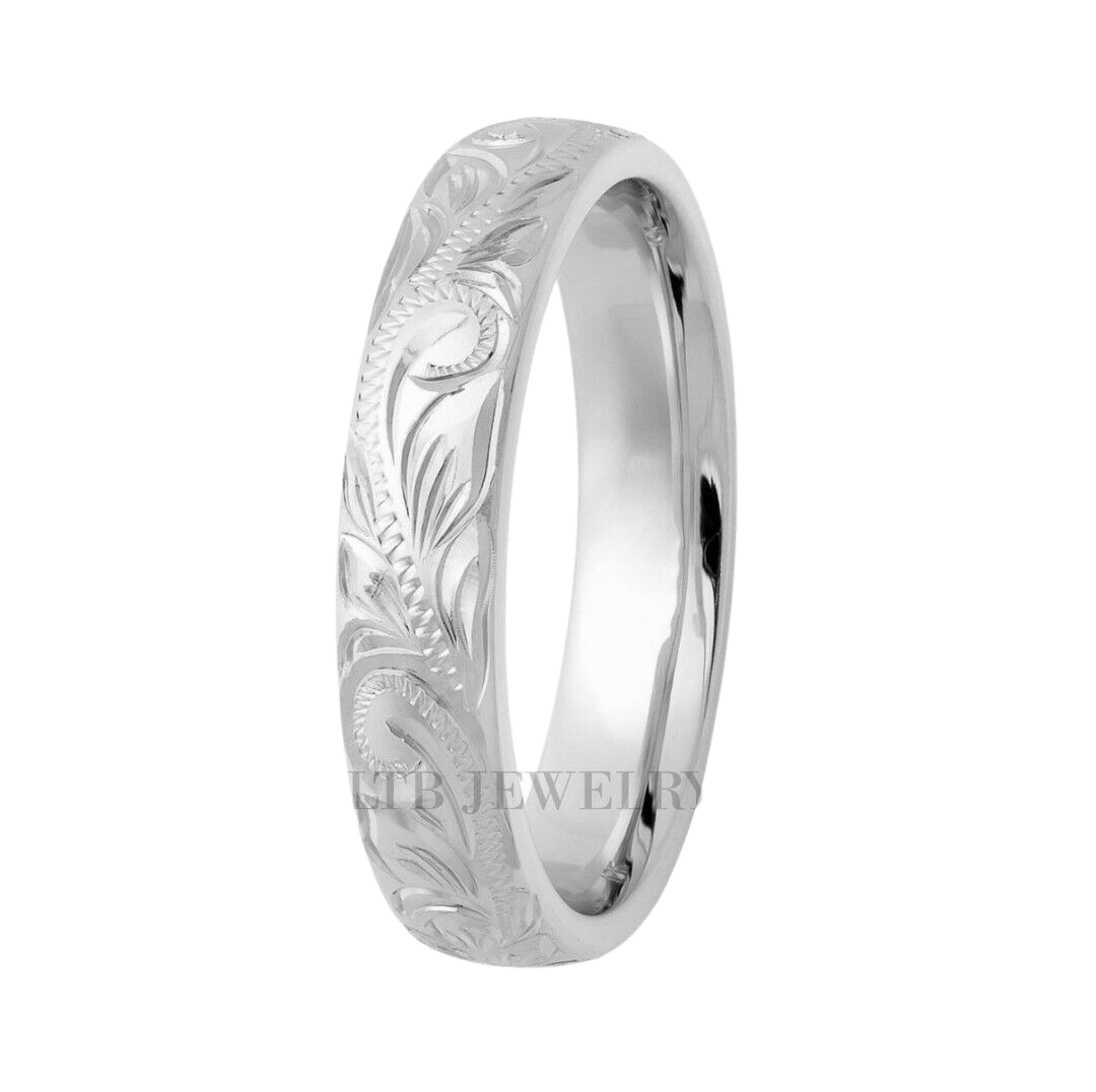 Hand engraved platinum wedding band with shiny finish and leaf motifs, 4mm comfort fit, made in New York.