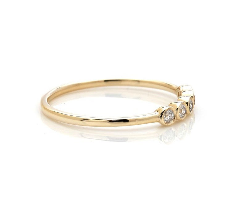 14K yellow gold minimalist diamond wedding ring featuring five 1.7mm round diamonds with shiny finish.