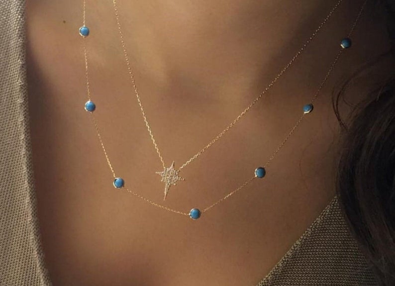 14K solid yellow gold beaded station turquoise necklace worn on a model's neck, showcasing minimalist elegance.