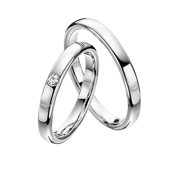 His and hers 10K 14K 18K white gold wedding bands with a diamond, featuring a shiny finish and comfort fit.