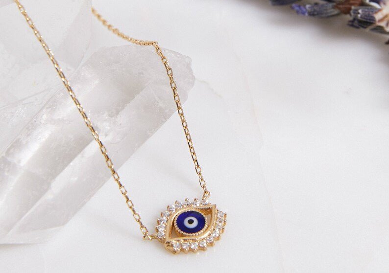 14K solid yellow gold evil eye necklace featuring a delicate design with CZ, perfect for everyday wear.