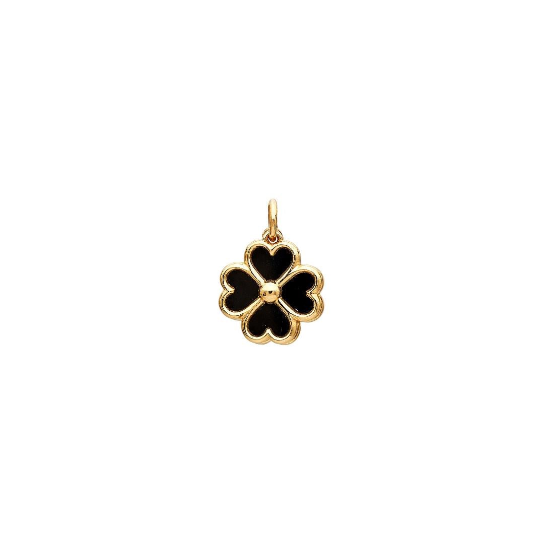 Gold four-leaf clover pendant with black enamel detailing, symbolizing luck and charm.