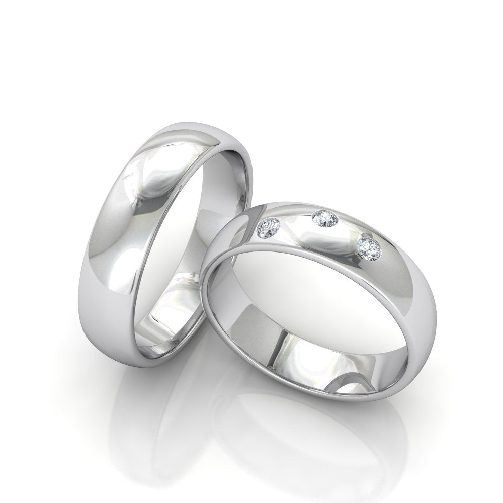 Simple 6mm white gold wedding bands for him and her with diamonds, featuring a shiny finish and comfort fit.
