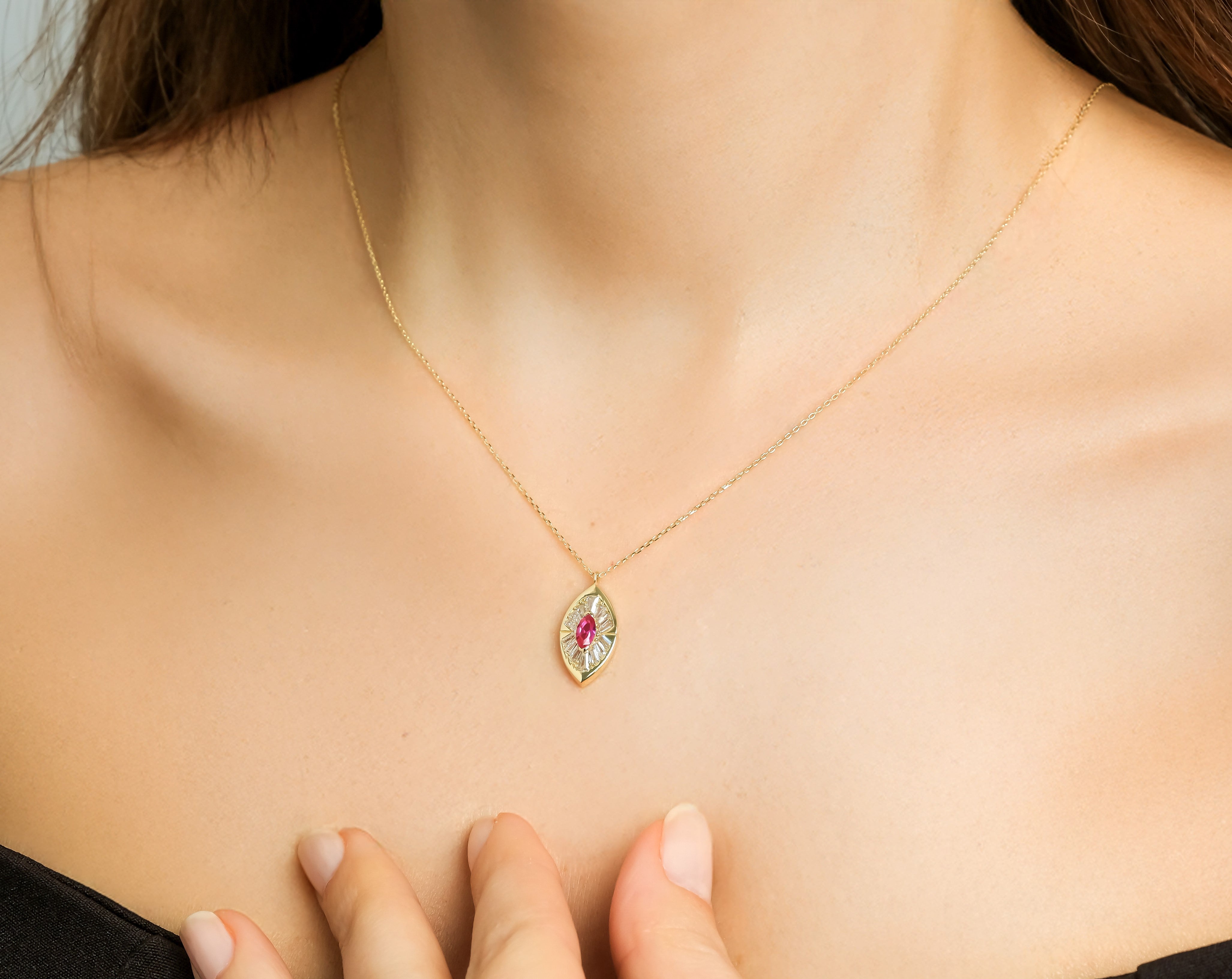 14K solid yellow gold marquise ruby necklace with CZ stones, worn elegantly, highlighting its delicate design.