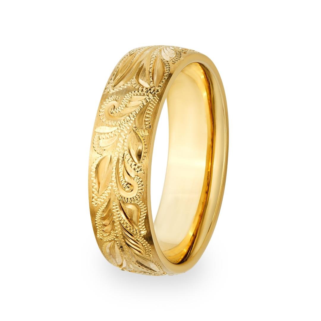 Hand engraved mens wedding band in solid yellow gold with shiny leaf motifs, 6mm wide, comfort fit, made in New York.