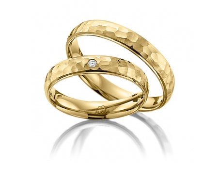 His and hers hammered finish yellow gold wedding bands with diamond, unique design and comfort fit.