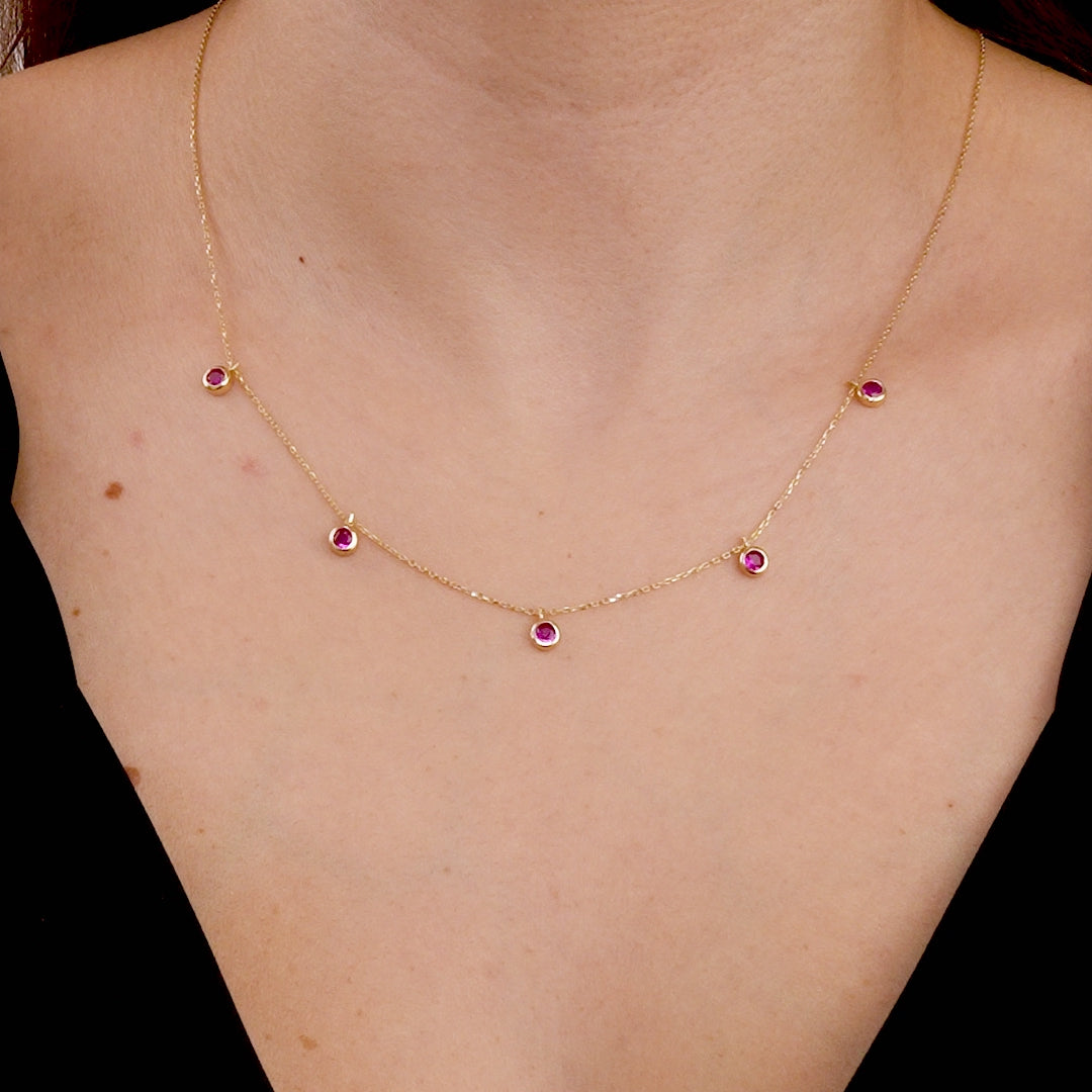 Dainty 14K solid yellow gold necklace with five lab-created ruby stations, perfect for everyday elegance.