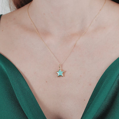14K yellow gold turquoise puffed star necklace worn on a model, elegant and perfect for everyday use.