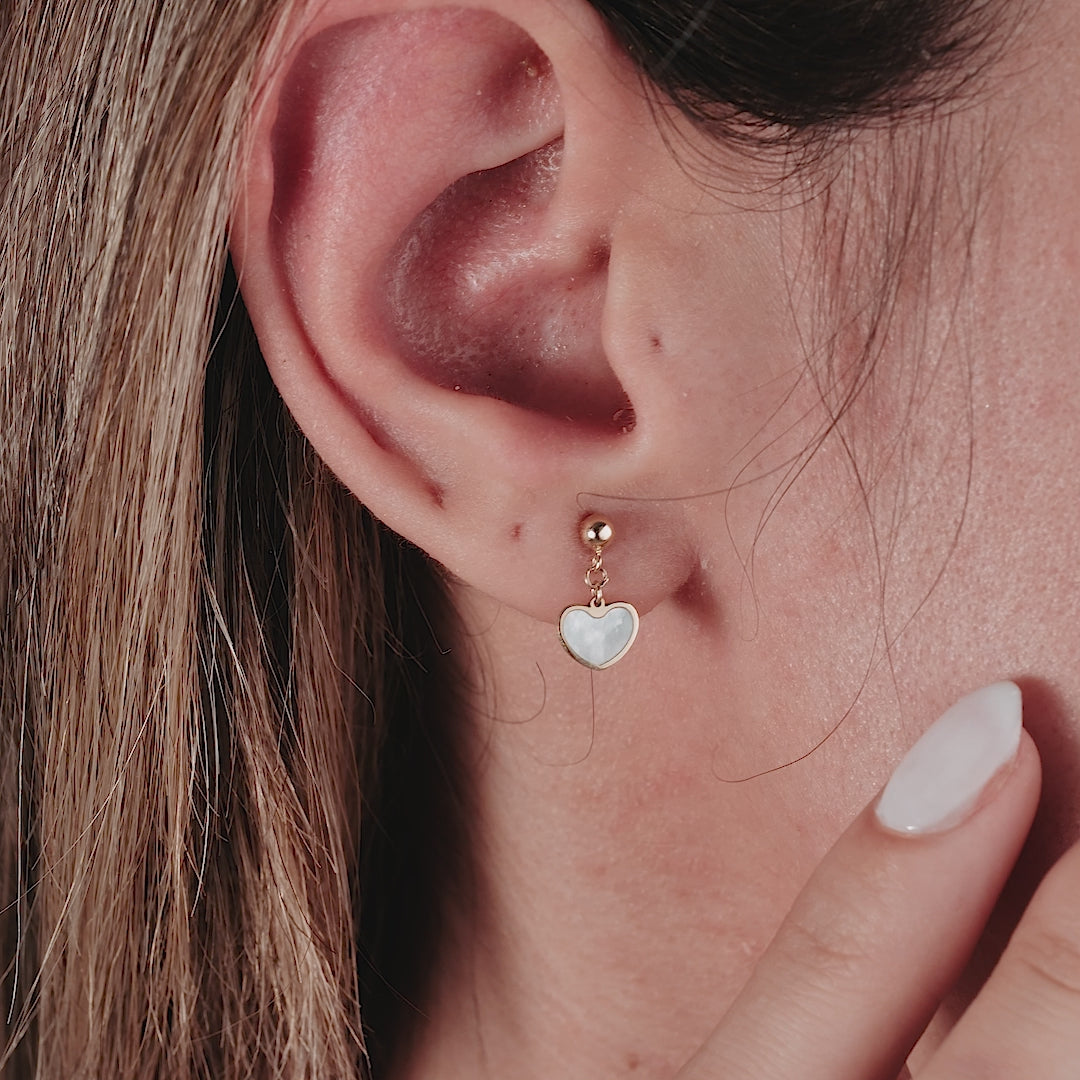 14K yellow gold dangle heart earrings with mother of pearl, minimalistic design for everyday elegance.