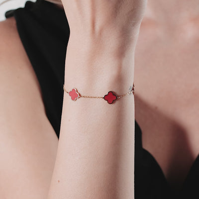 Elegant 14K solid yellow gold bracelet with red coral four leaf clover design, perfect for everyday wear.