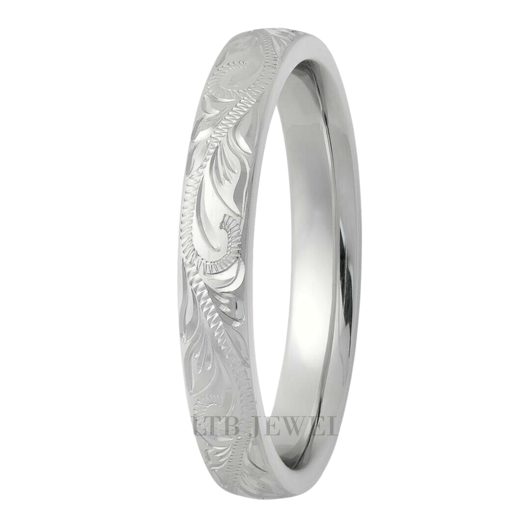 Hand engraved white gold wedding band with leaf motifs, 3mm wide, comfort fit, made in New York, available in various metals.