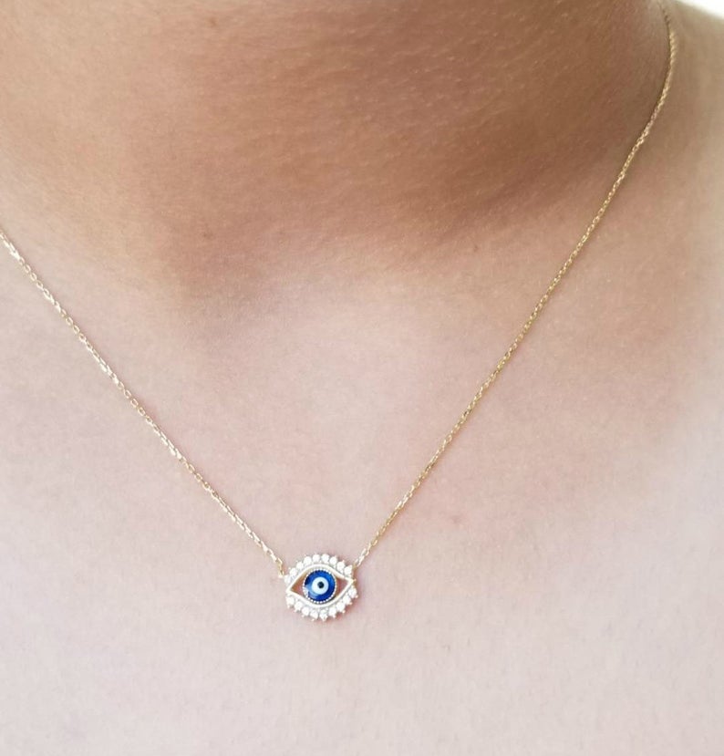 14K solid yellow gold minimalist evil eye necklace featuring cubic zirconia, perfect for everyday wear.