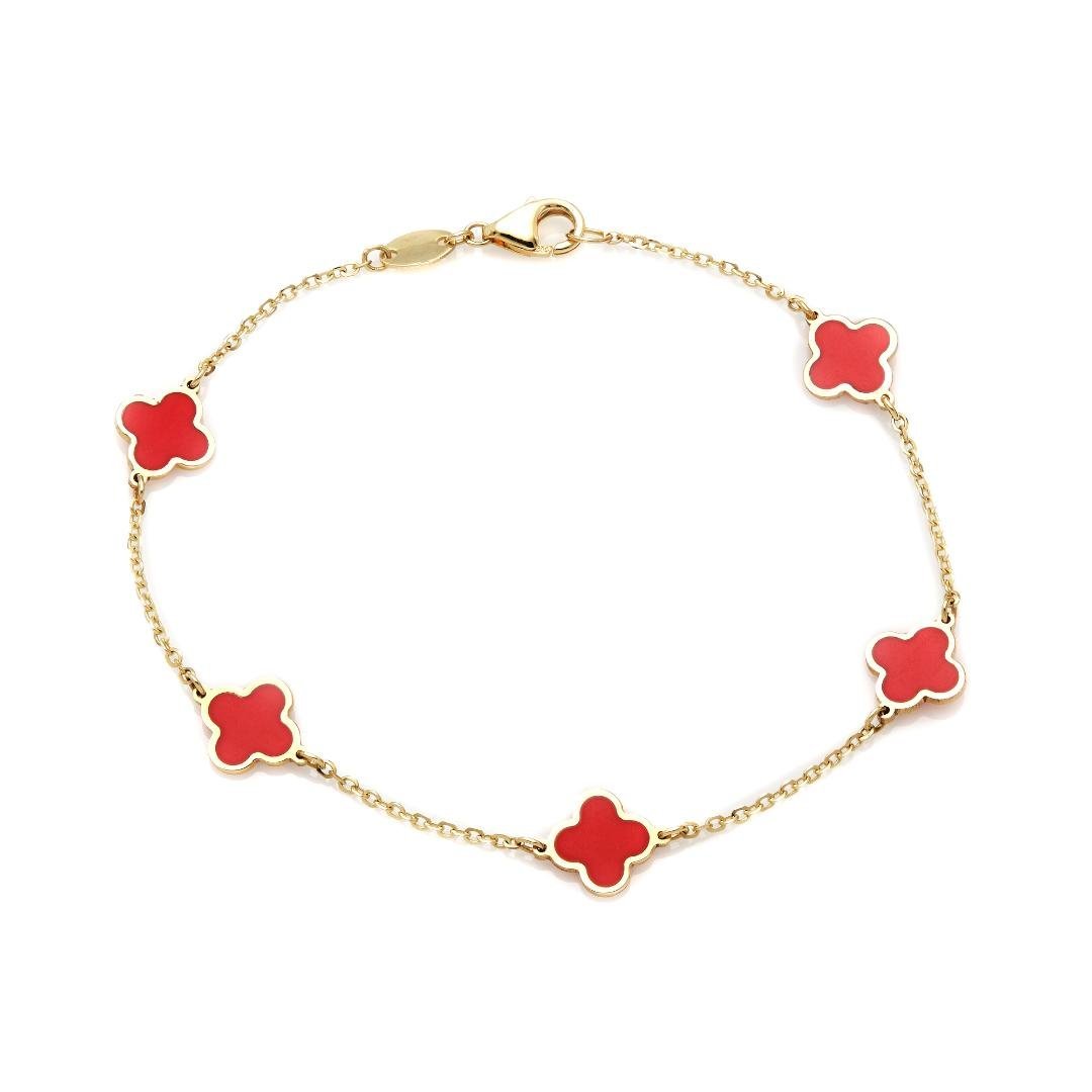 14K solid yellow gold bracelet featuring red coral four leaf clovers, 7-inch length with lobster claw clasp.