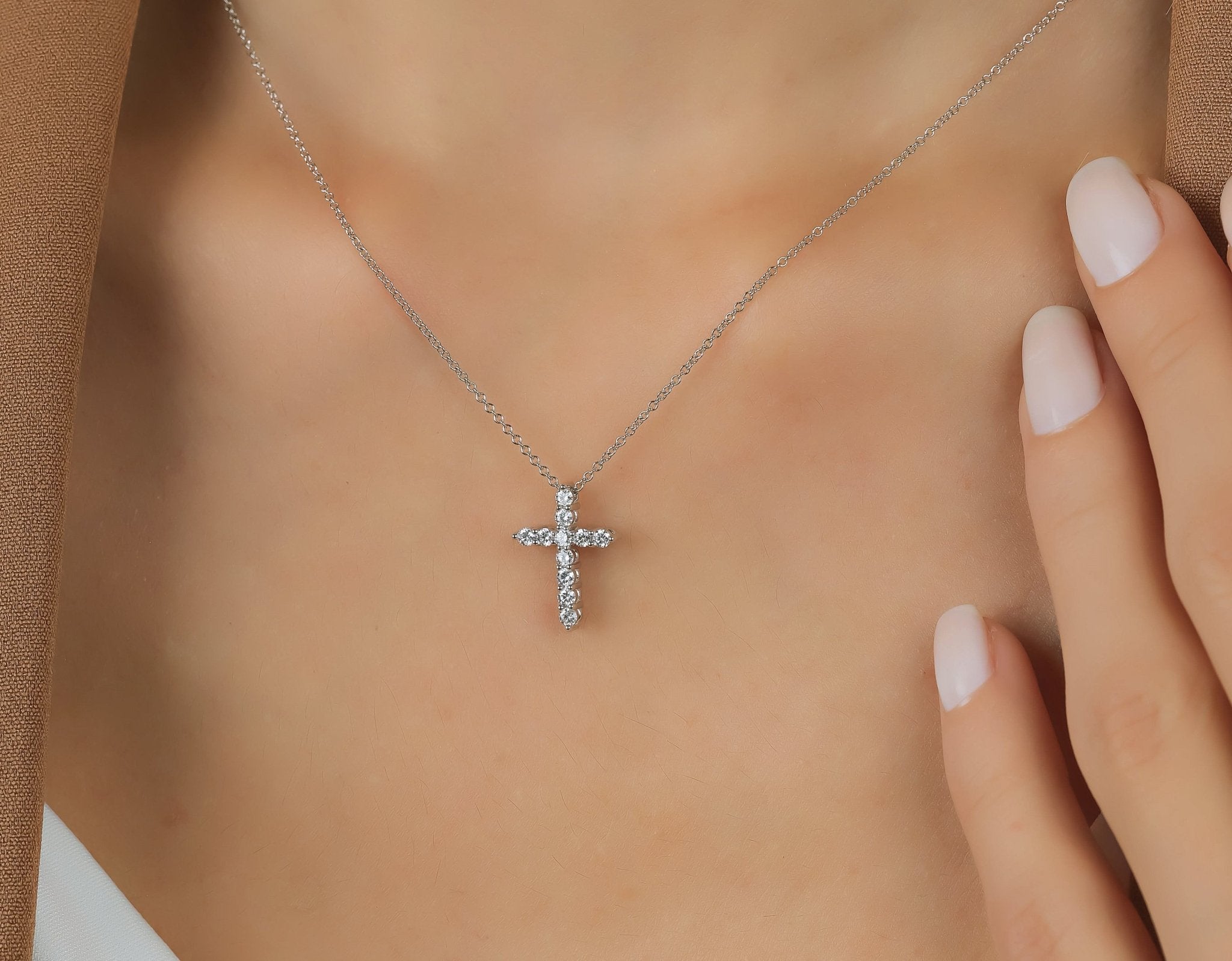 14K solid white gold diamond cross necklace worn on model, showcasing 0.35 carats of sparkling lab-created diamonds.