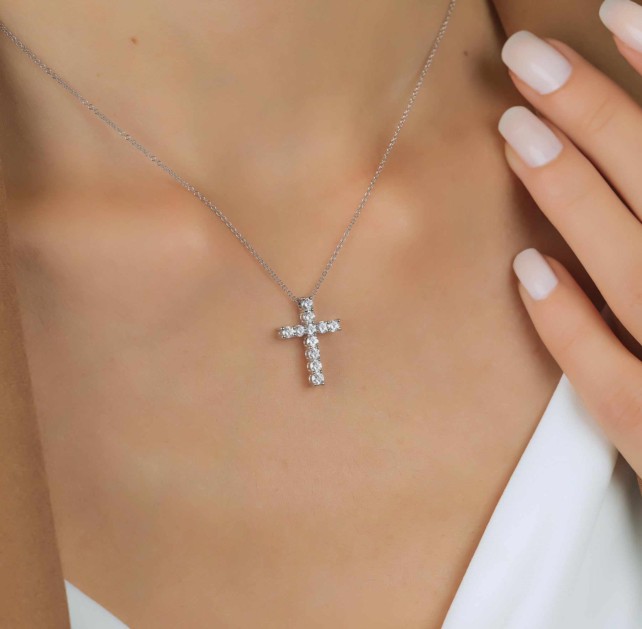 14K white gold cross necklace with 0.55 carat lab-created diamonds, showcasing a beautiful sparkle.
