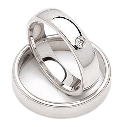 His and hers wedding rings set in shiny 10K white gold, featuring a diamond on her band, comfort fit design.