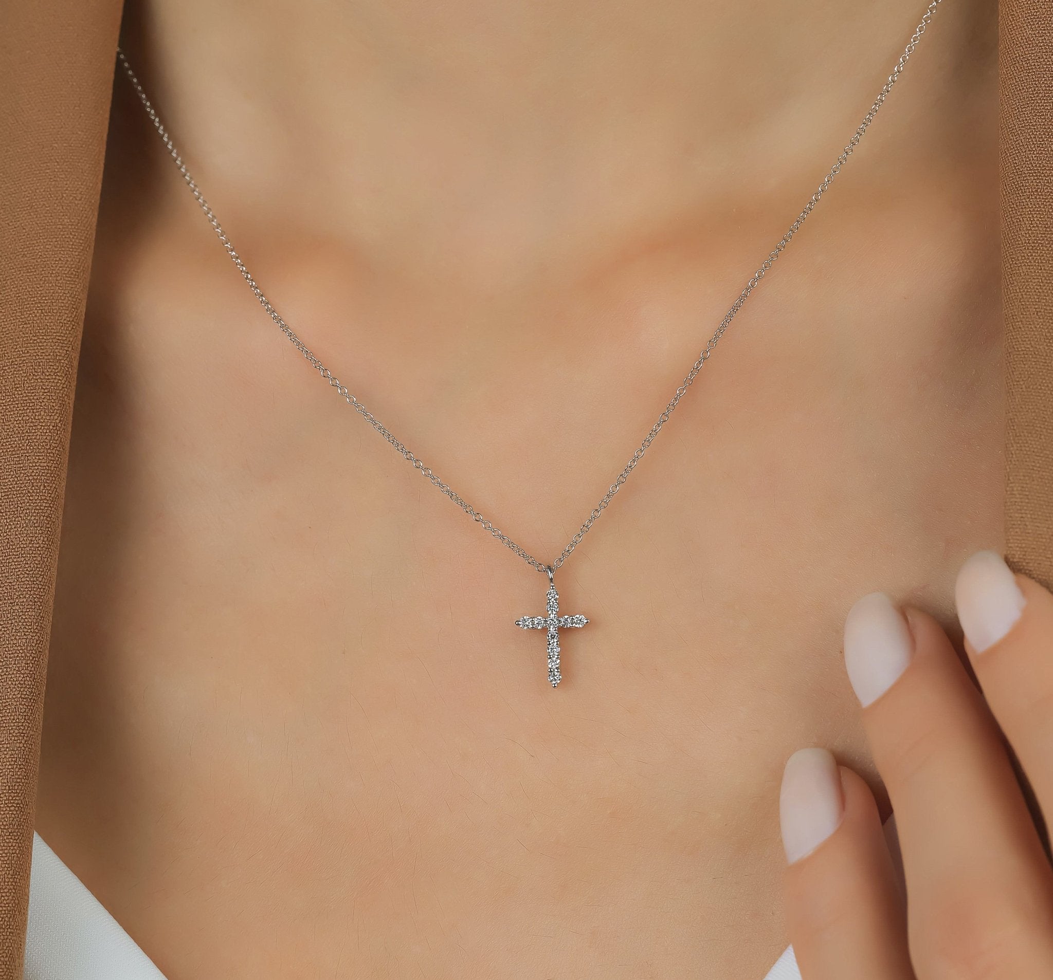 14K white gold diamond cross necklace worn on a model, featuring a minimalist design with sparkling lab-created diamonds.