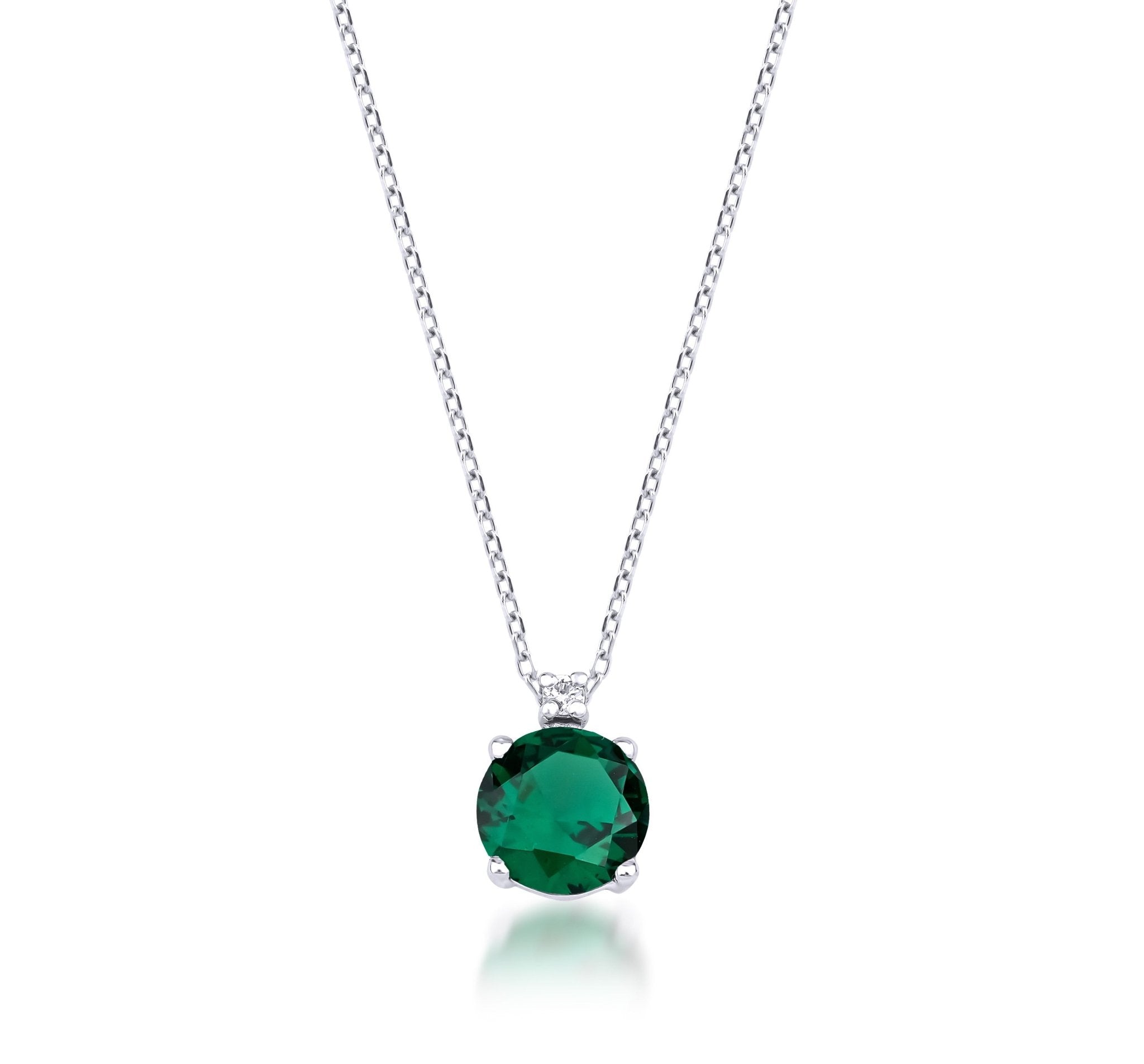 14K white gold necklace featuring a stunning lab-created emerald solitaire pendant and diamond accent.