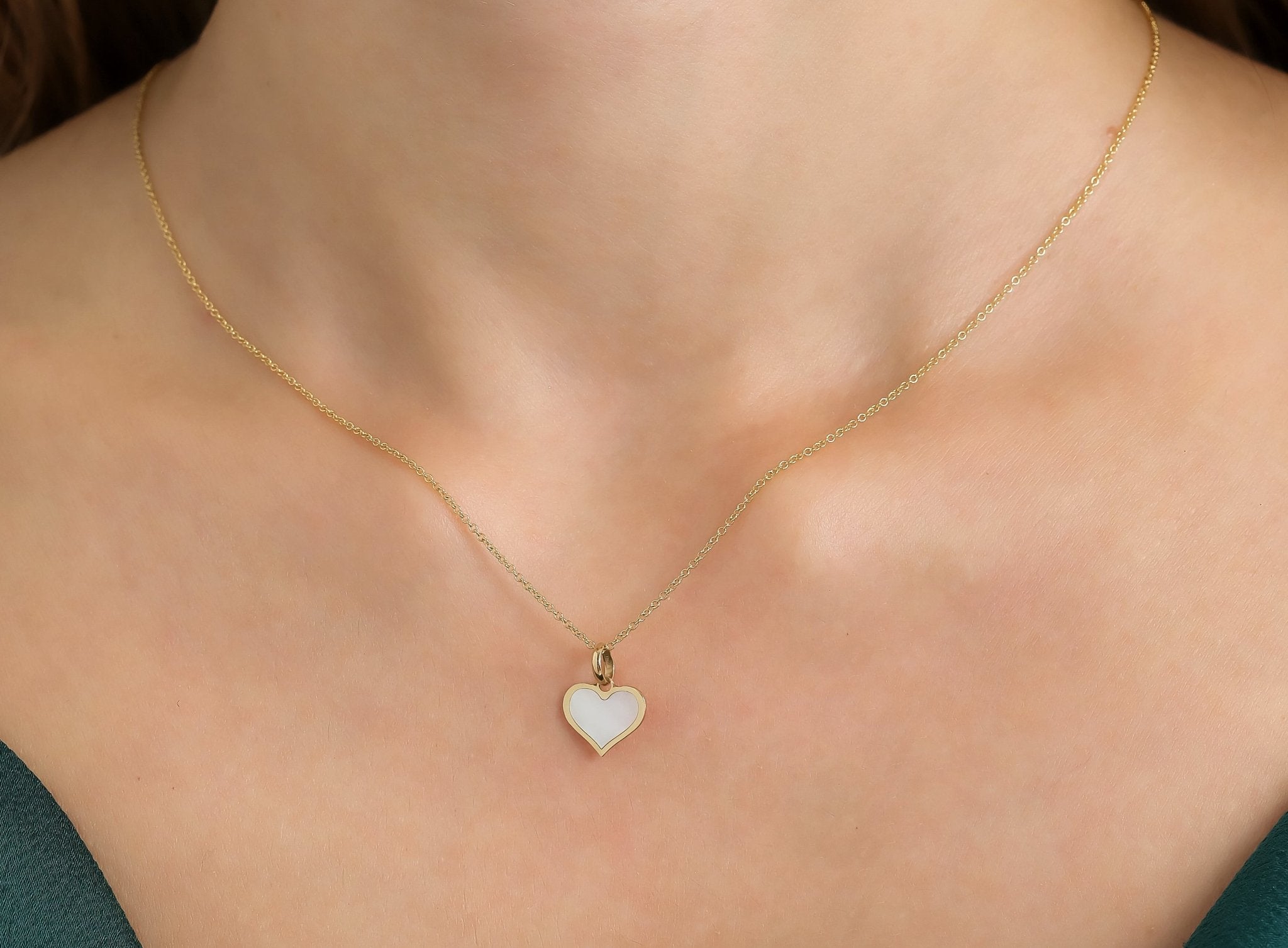 14K yellow gold minimalist heart necklace with natural mother of pearl pendant, perfect for everyday elegance.