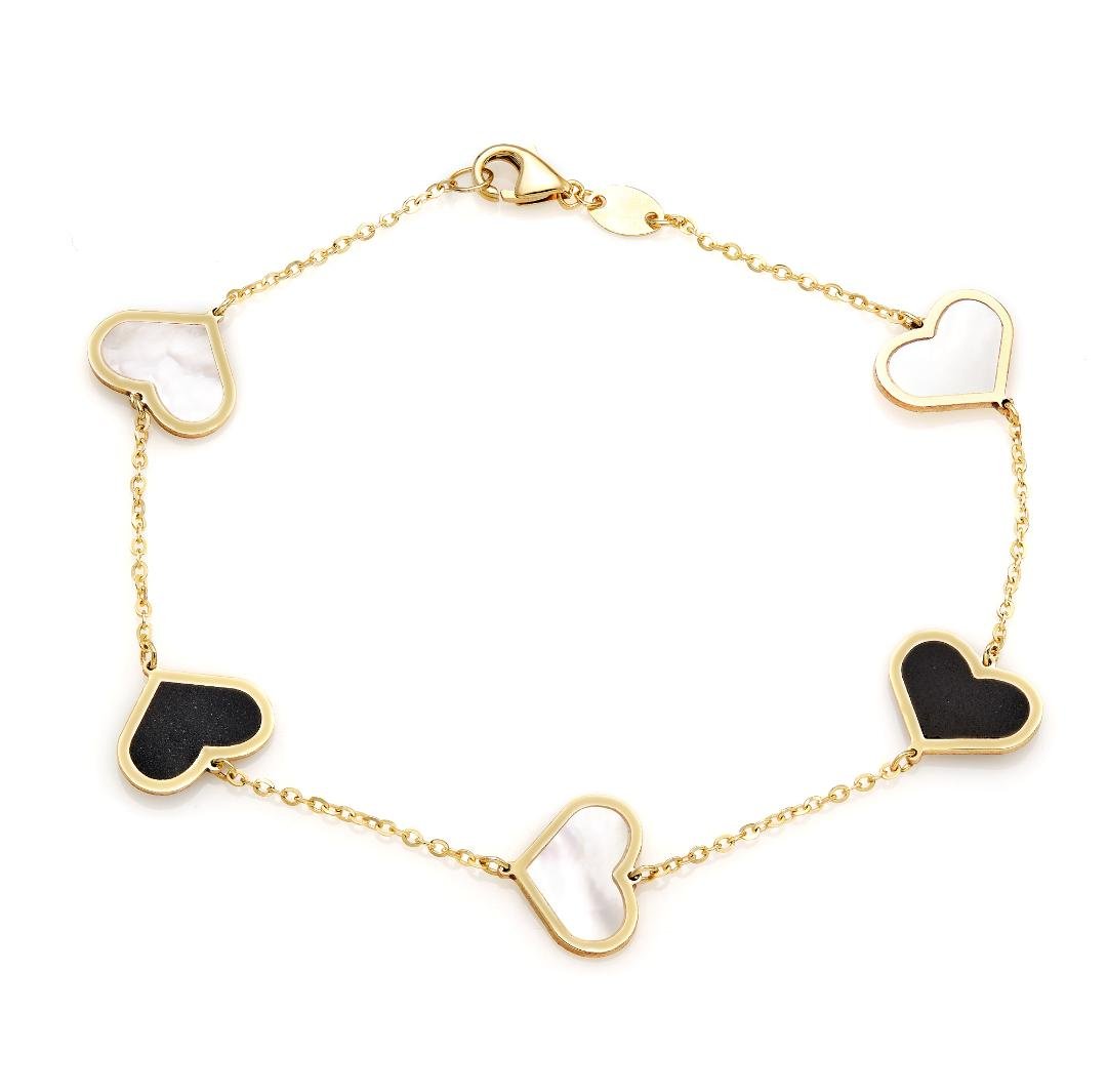 14K yellow gold bracelet featuring alternating onyx and mother of pearl heart charms in a gift box.