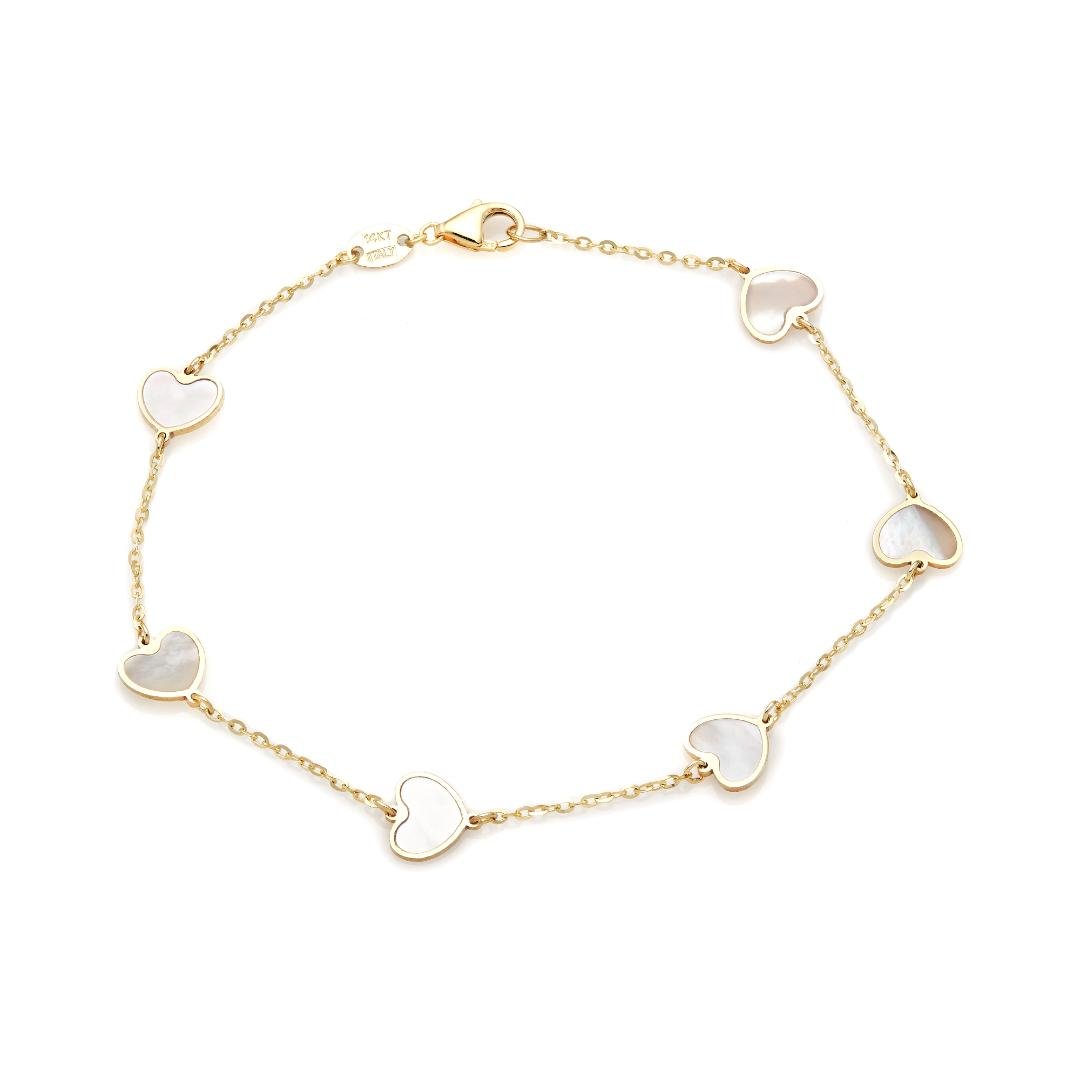 14K yellow gold bracelet with mother of pearl heart charms, 7 inches long, perfect for everyday elegance.