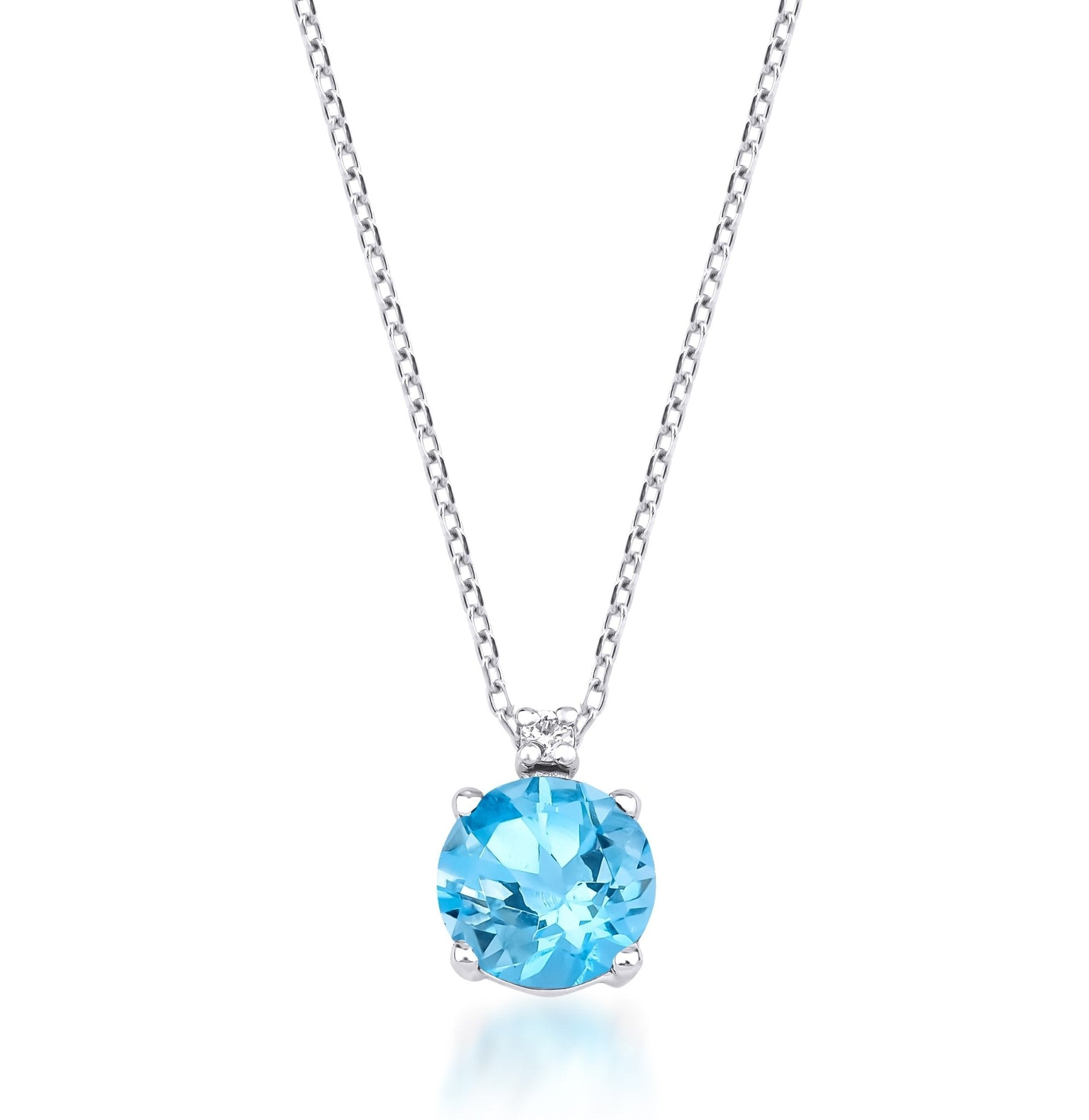14K white gold necklace featuring a stunning blue topaz solitaire pendant with a single natural diamond.
