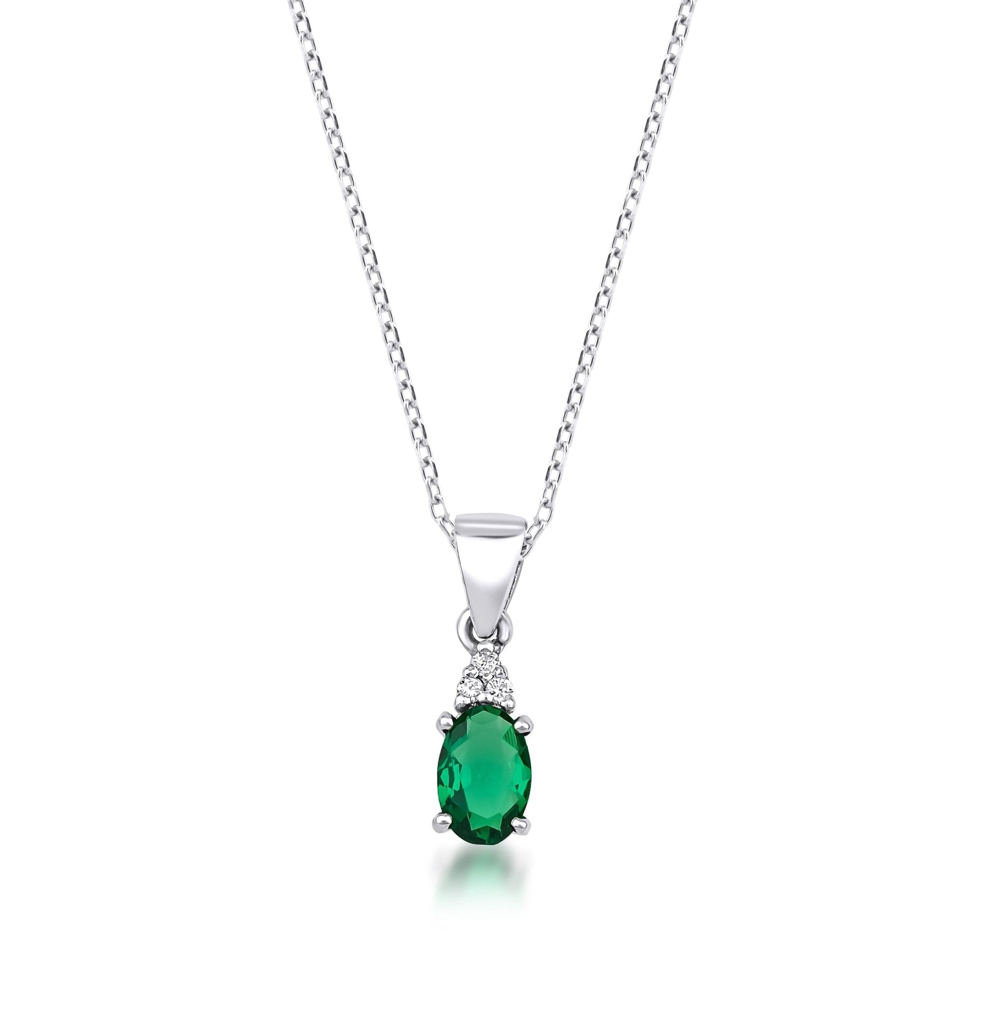 14K white gold oval emerald solitaire necklace with natural diamond accents, elegant and dainty design.