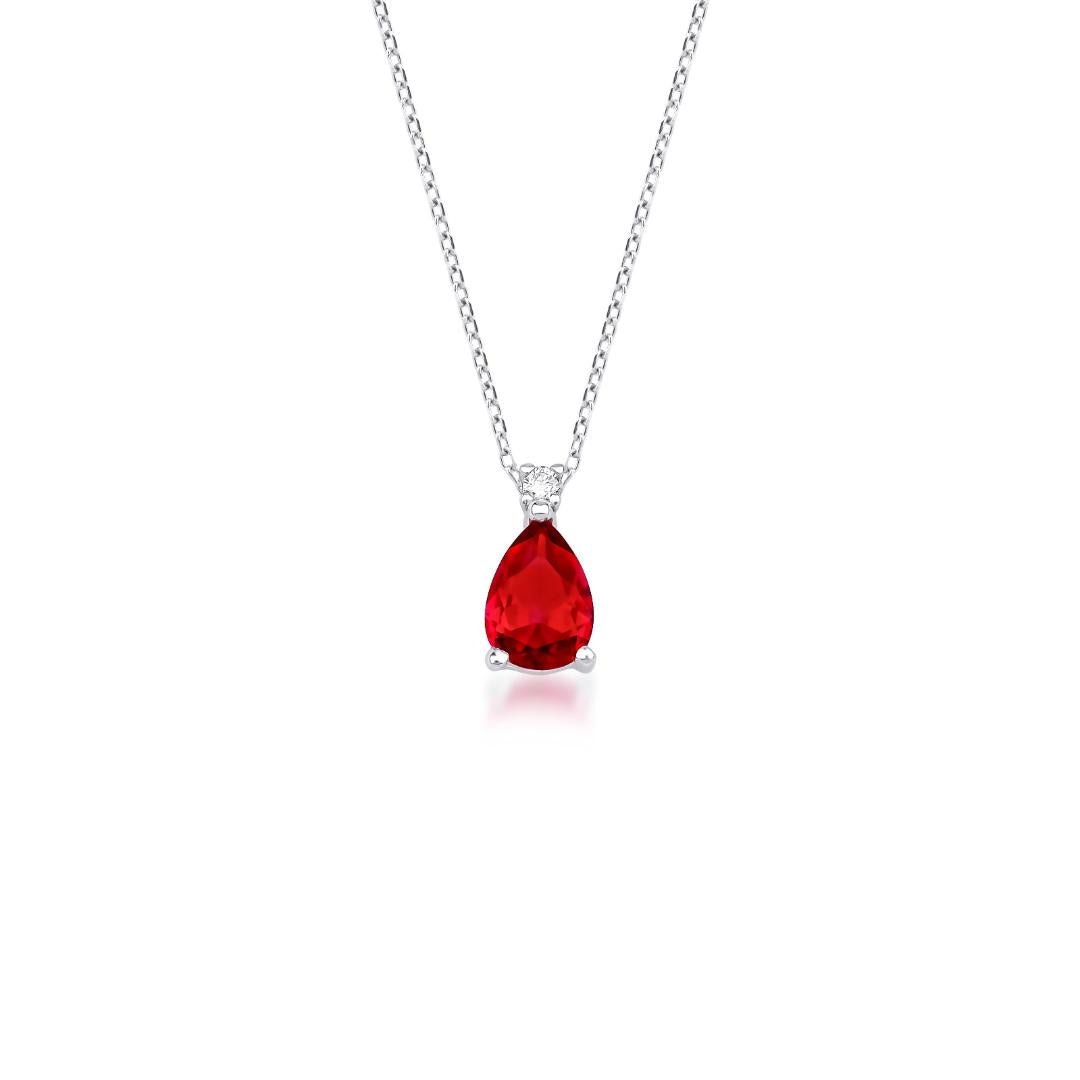 14K white gold pear shape ruby and diamond solitaire necklace, featuring a stunning lab created ruby pendant.
