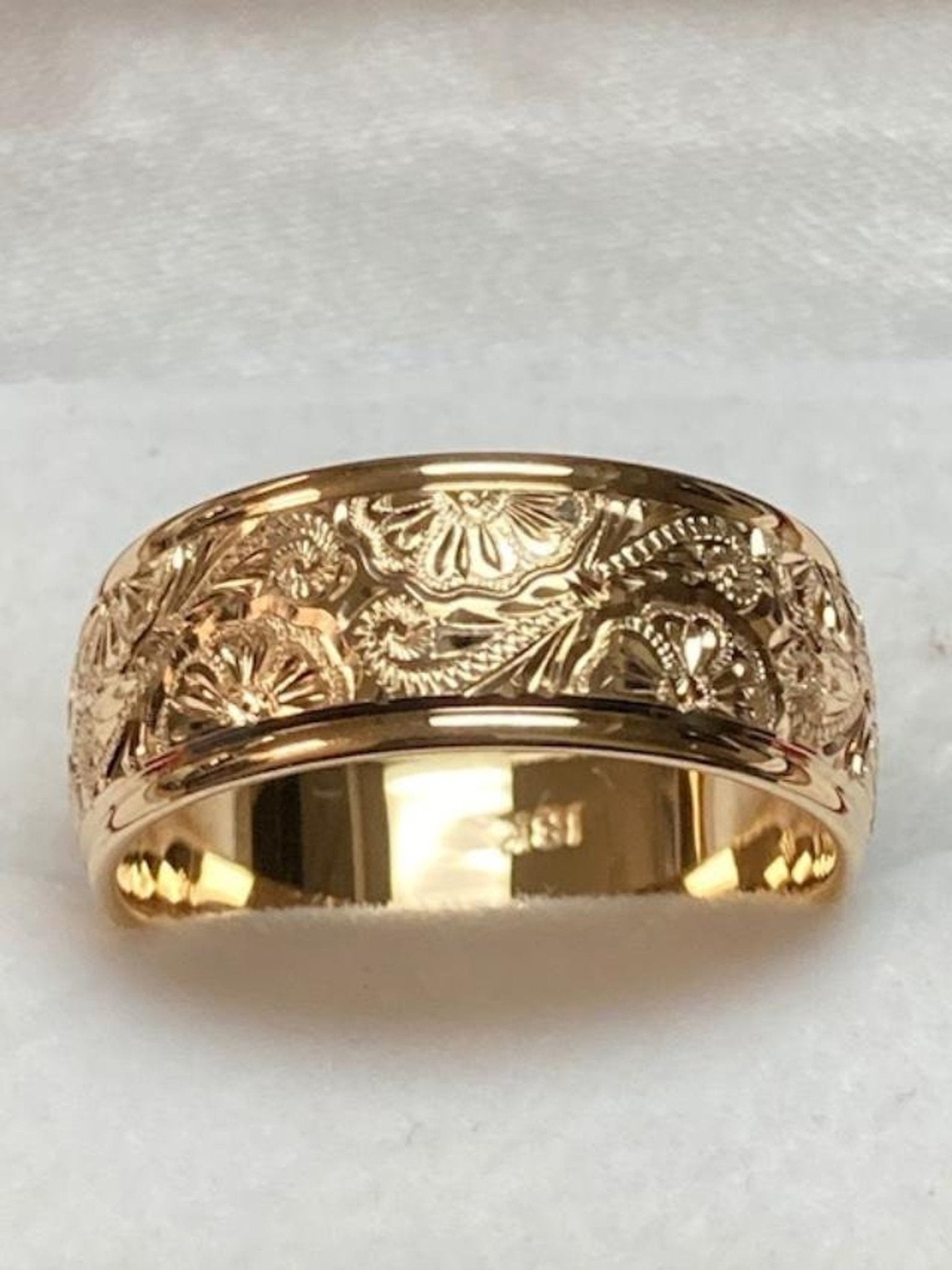 8mm 14K Yellow Gold hand engraved mens wedding band with leaf motif and shiny finish, made in New York, USA.