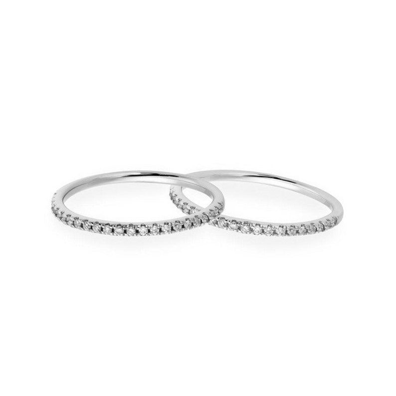 Two elegant micro pave eternity diamond wedding bands in white gold, showcasing sparkling stones and ultra-thin design.