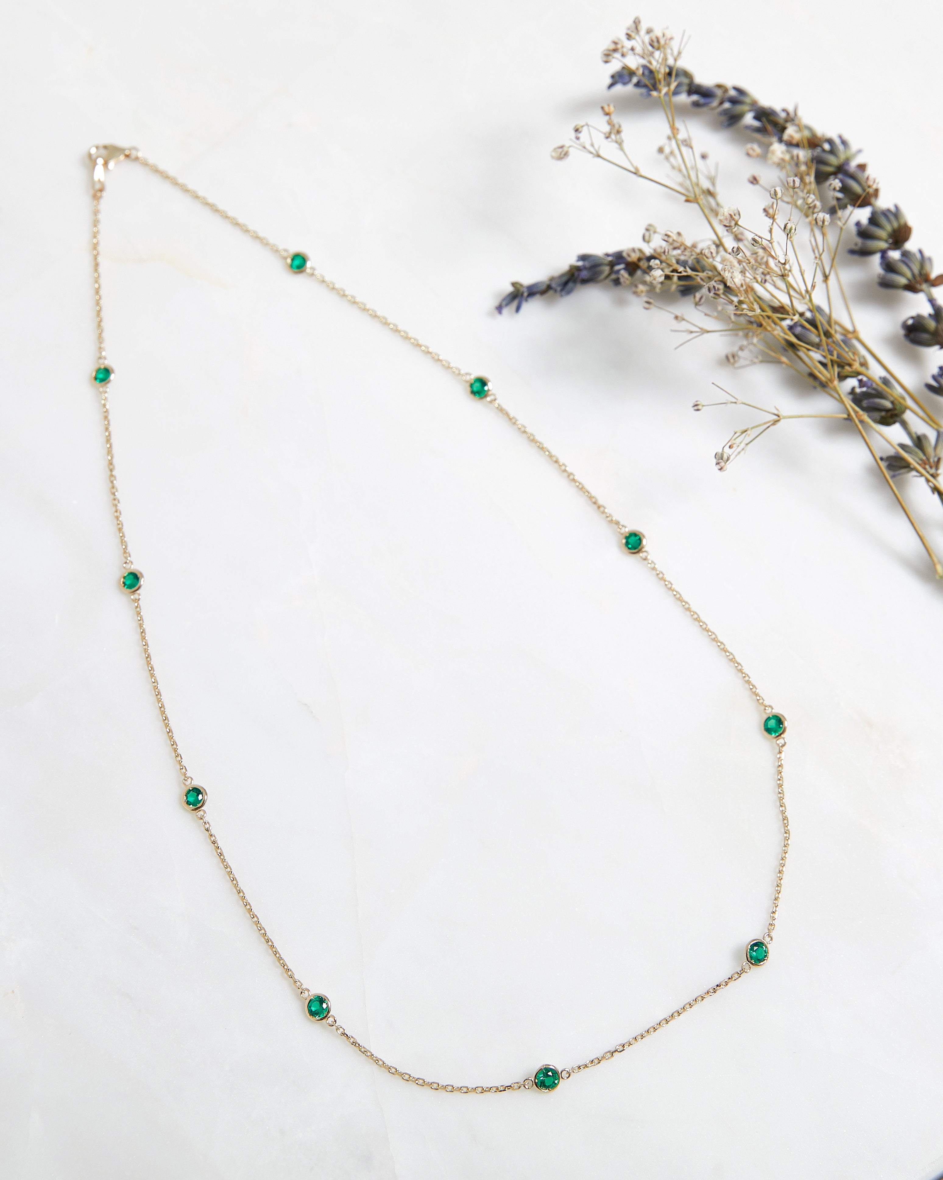 14K gold emerald station necklace featuring 10 lab-created emeralds, elegant and dainty design, perfect for everyday wear.
