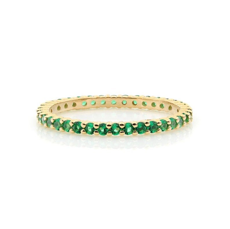 14K yellow gold full eternity ring with prong-set lab-created emeralds, perfect for stacking or as a wedding band.