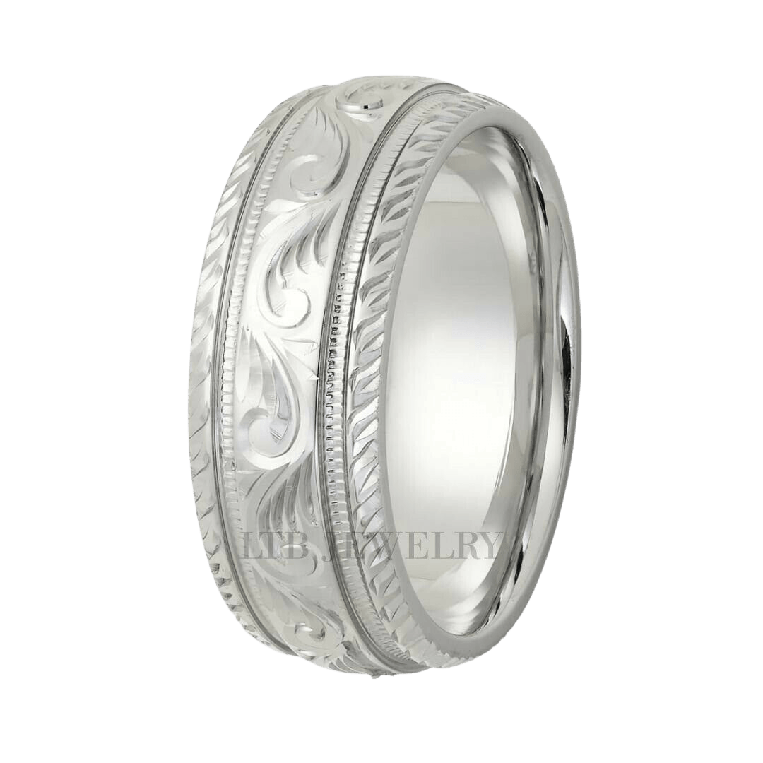 Hand engraved platinum men's wedding band with leaf motifs and shiny finish, comfort fitted, crafted in New York.
