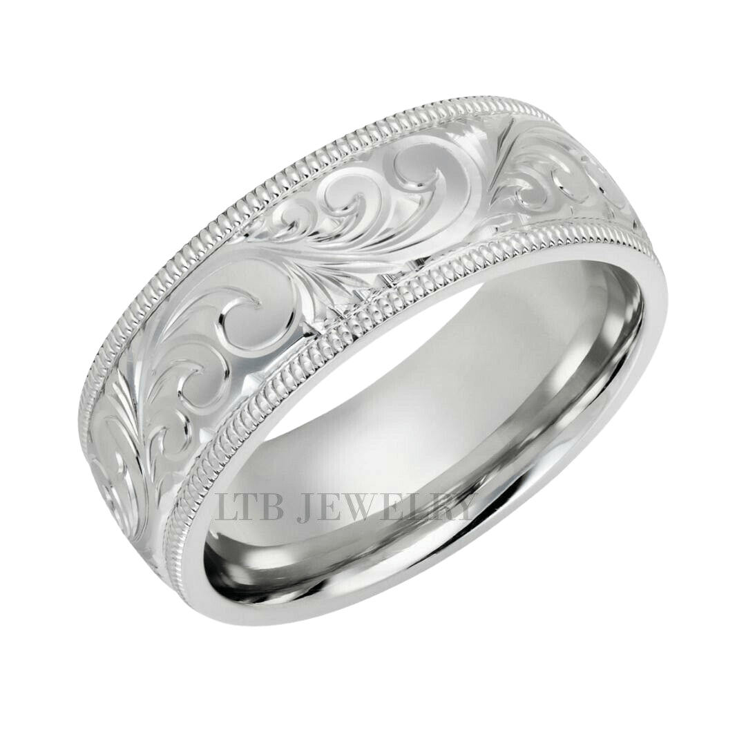 Hand engraved platinum men's wedding band with leaf motifs and milgrain edges, 7mm shiny finish.