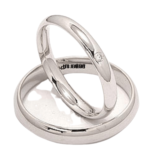 His and Hers platinum wedding bands with shiny finish and diamond accent, showcasing simple elegance.