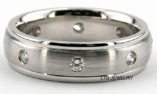 Men's platinum diamond wedding band featuring a satin finish and shiny edges with round brilliant cut diamonds.