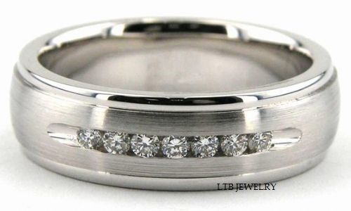 Platinum men's diamond wedding band featuring 7 round brilliant cut diamonds and satin finish, comfort fit design.